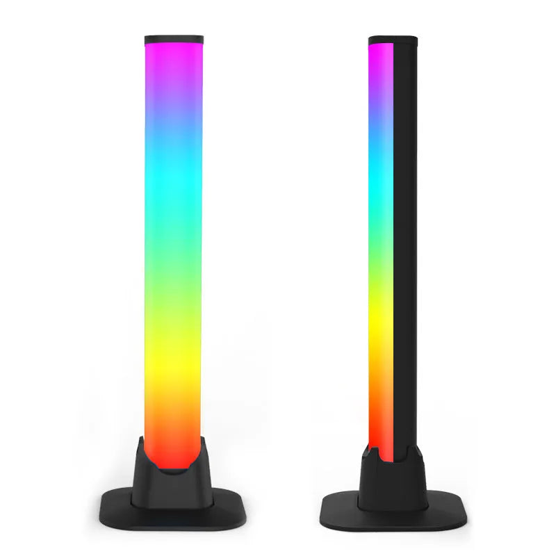 Two black desktop atmosphere lights with USB cables and app control interface on a gaming desk