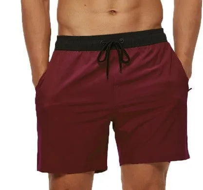 Men's blue running shorts with zipper pocket and drawstring waist detail for fitness activities