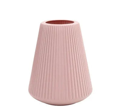 Plastic melamine decorative flower vase in blue colour on wooden surface