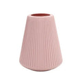 Plastic melamine decorative flower vase in blue colour on wooden surface