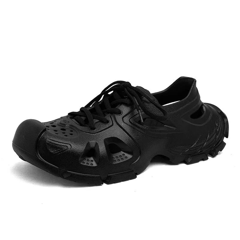 Men's black lace-up outdoor sports sandals with round toe and EVA sole on a rocky path.