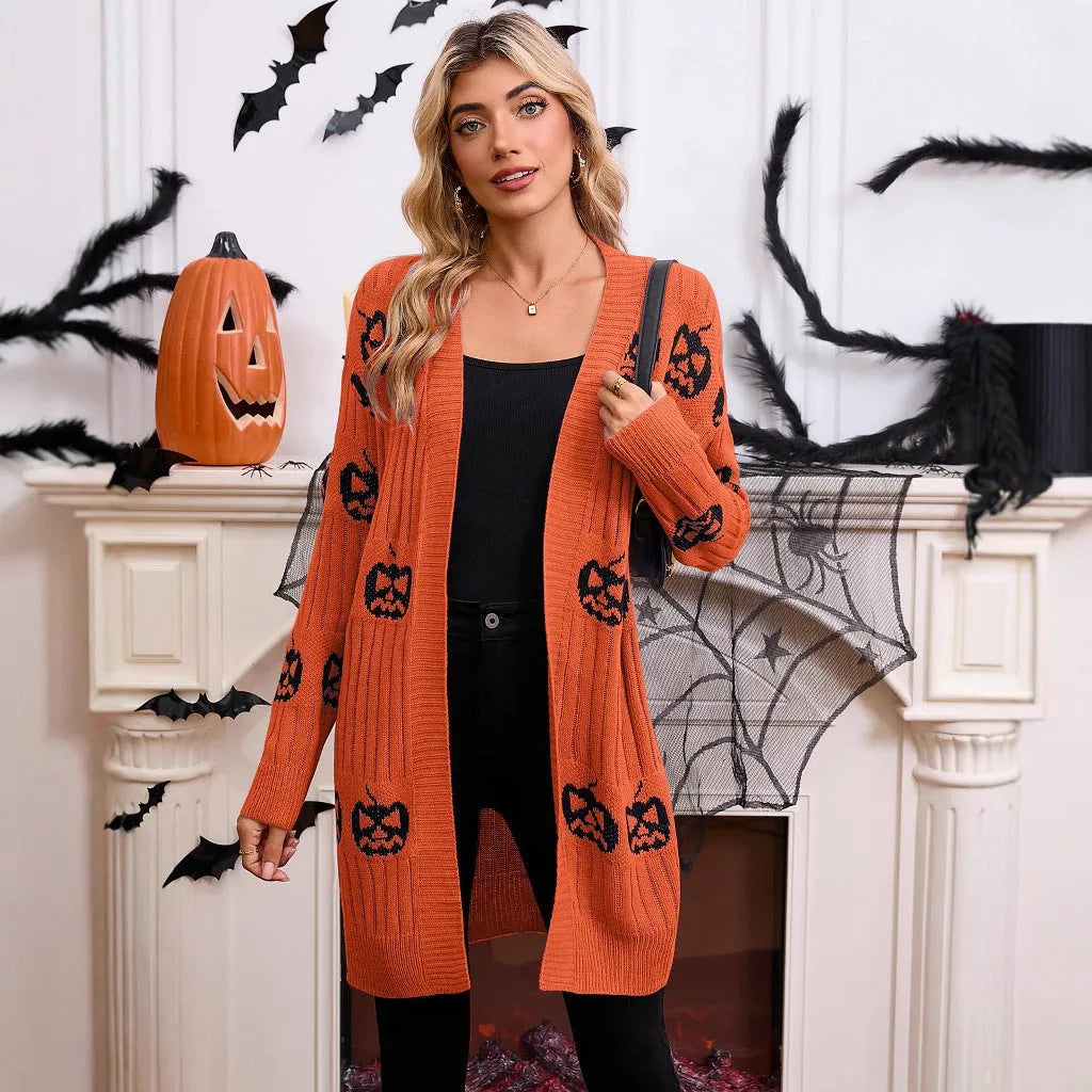 Women's black cardigan with orange knitted pumpkin head jacquard pattern.