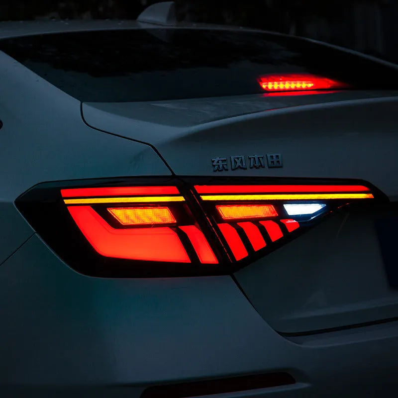 Black and red LED taillight assembly for 11th Generation Honda Civic with sequential light strip.