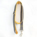 Grey and yellow polyester dog leash on plain background, available in multiple sizes from XS to XL