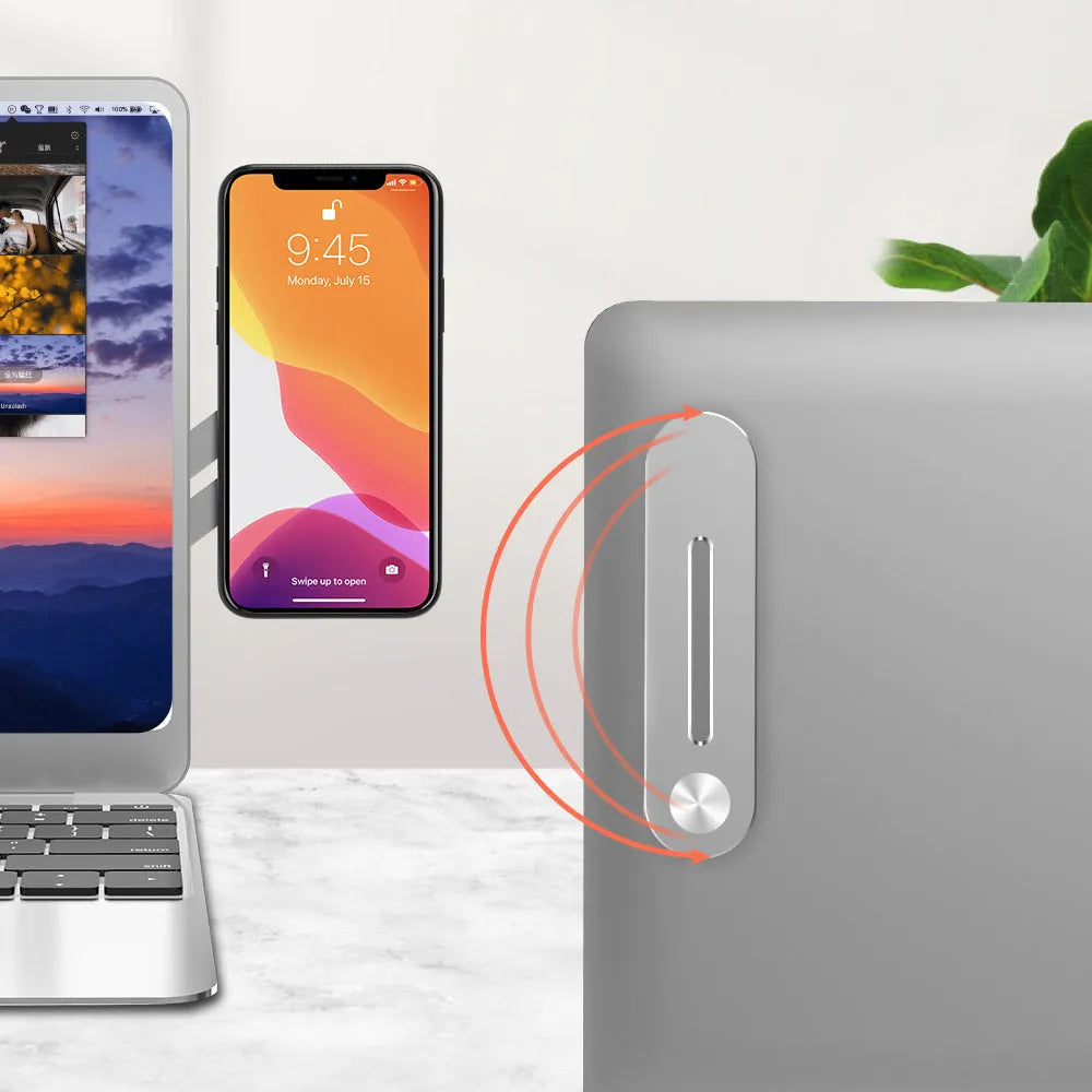Silver aluminium alloy laptop side mount bracket holding a smartphone next to a laptop.