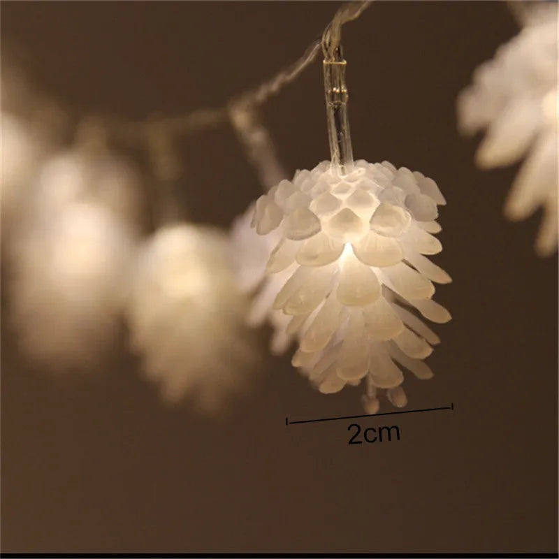 Warm white battery-operated LED pine cone string lights for decoration, showing plastic shell design.