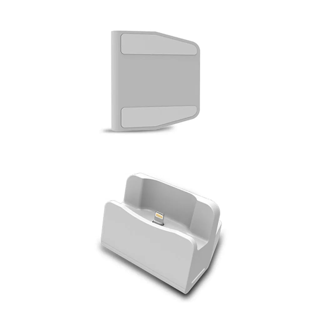 White plastic headphone charging base for wireless earbuds on desk
