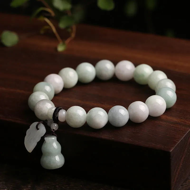 Natural green jade bracelet with geometric pendant featuring Maitreya Buddha design for women.