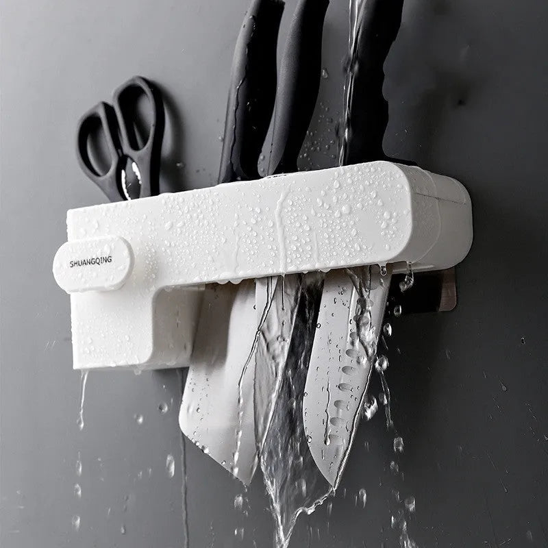 White plastic kitchen knife rack with modern simple design placed on countertop