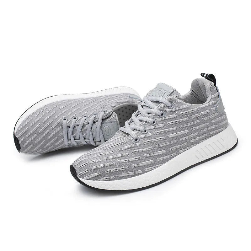 Men's Malcom low-top sneaker with mesh fabric upper and MD sole in black, grey, and white