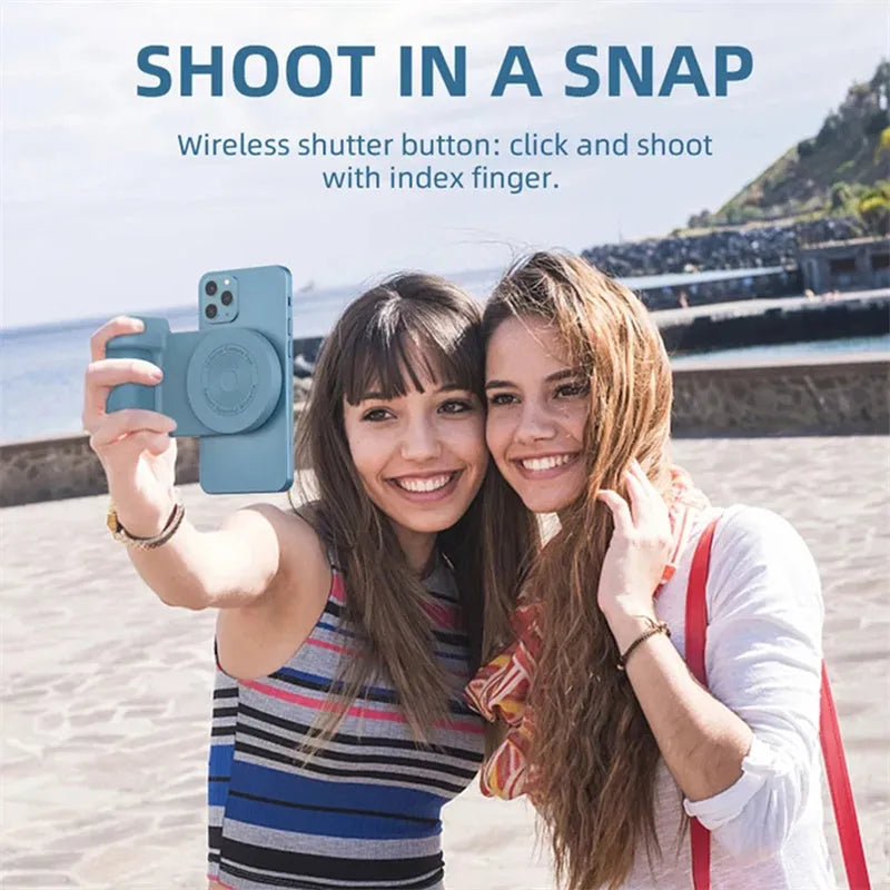 Black magnetic camera grip phone holder with rotatable bracket on wooden table