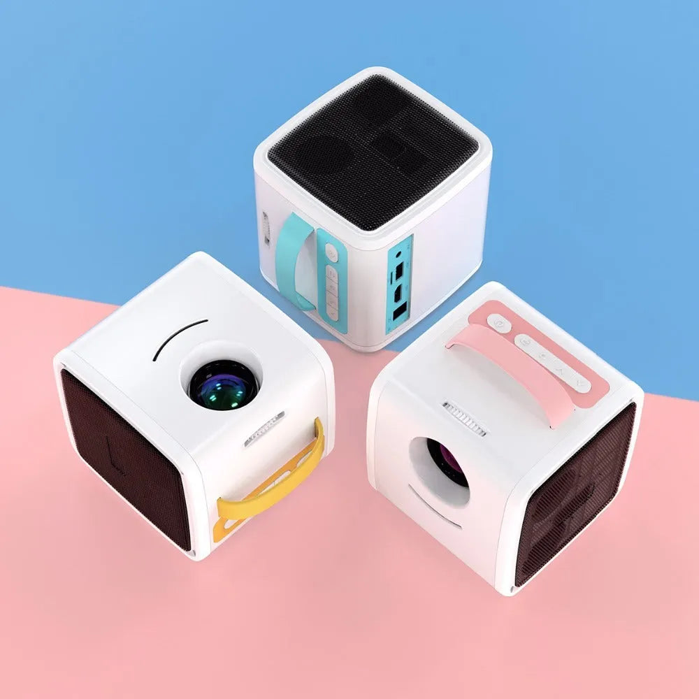 Mini home theater projector with 20W LED bulb projecting onto a wall, available in Blue US or Pink US colour options