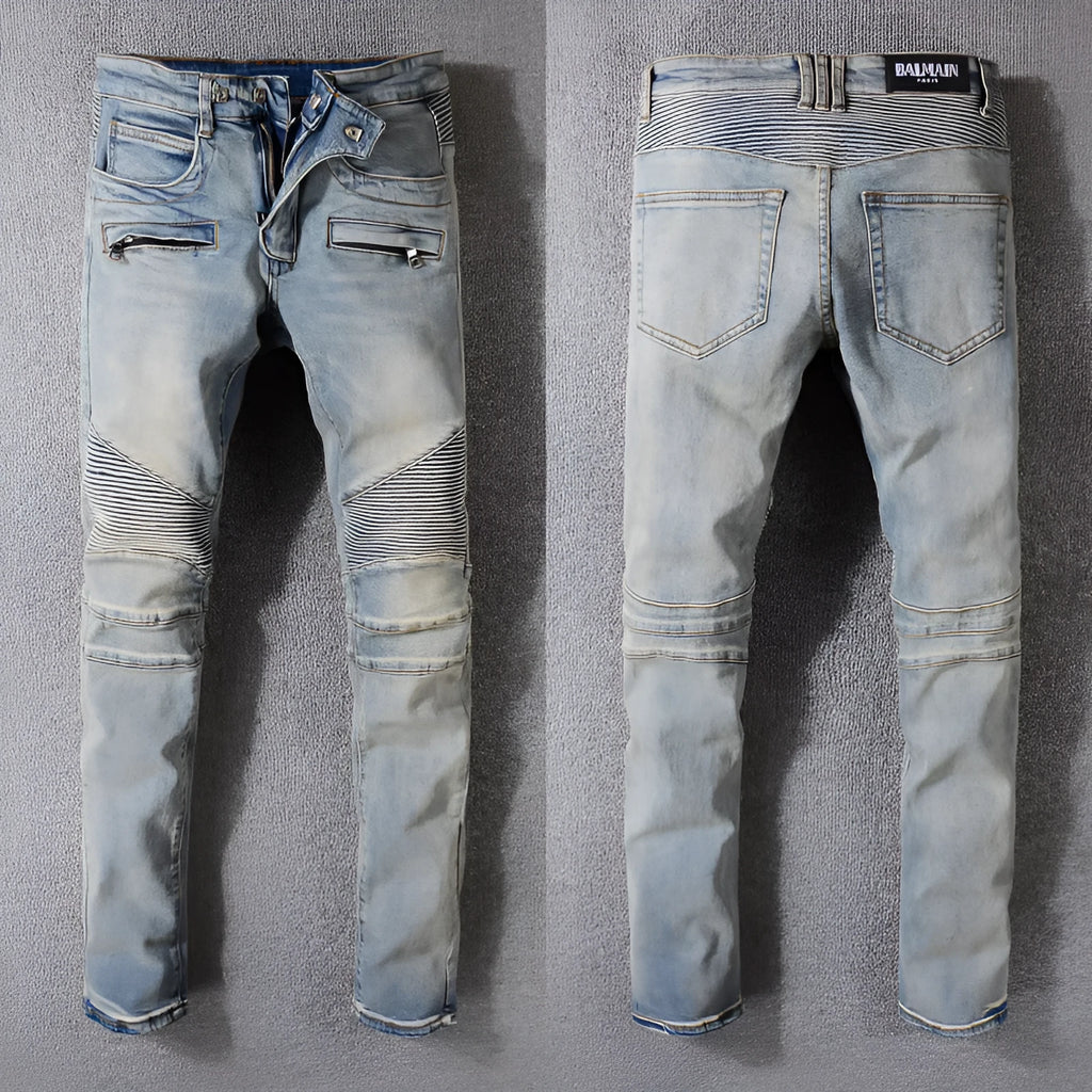 Grey biker jeans with straight tube leg, mid-rise waist, zipper fly, and distressed denim finish