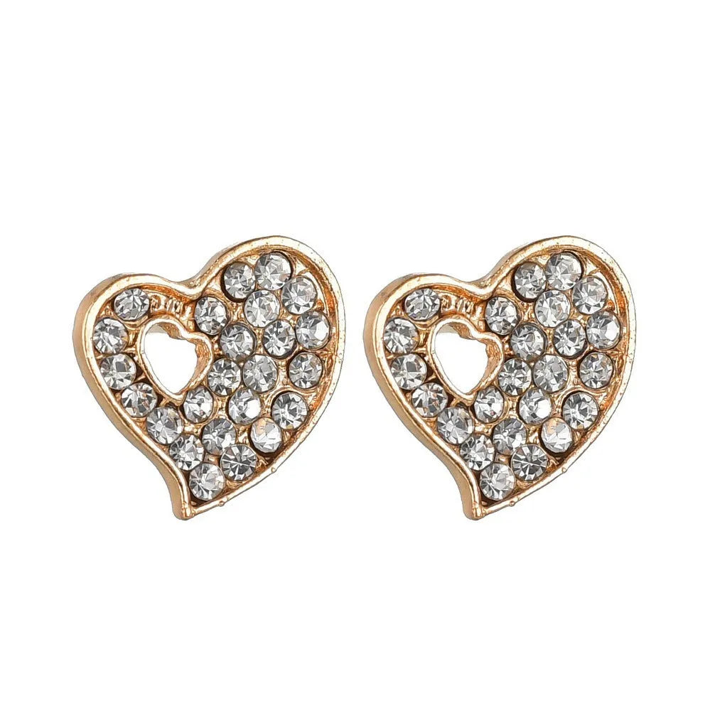 Women's gold tone alloy jewelry set with matching earrings, pendant and bracelet featuring love patterns
