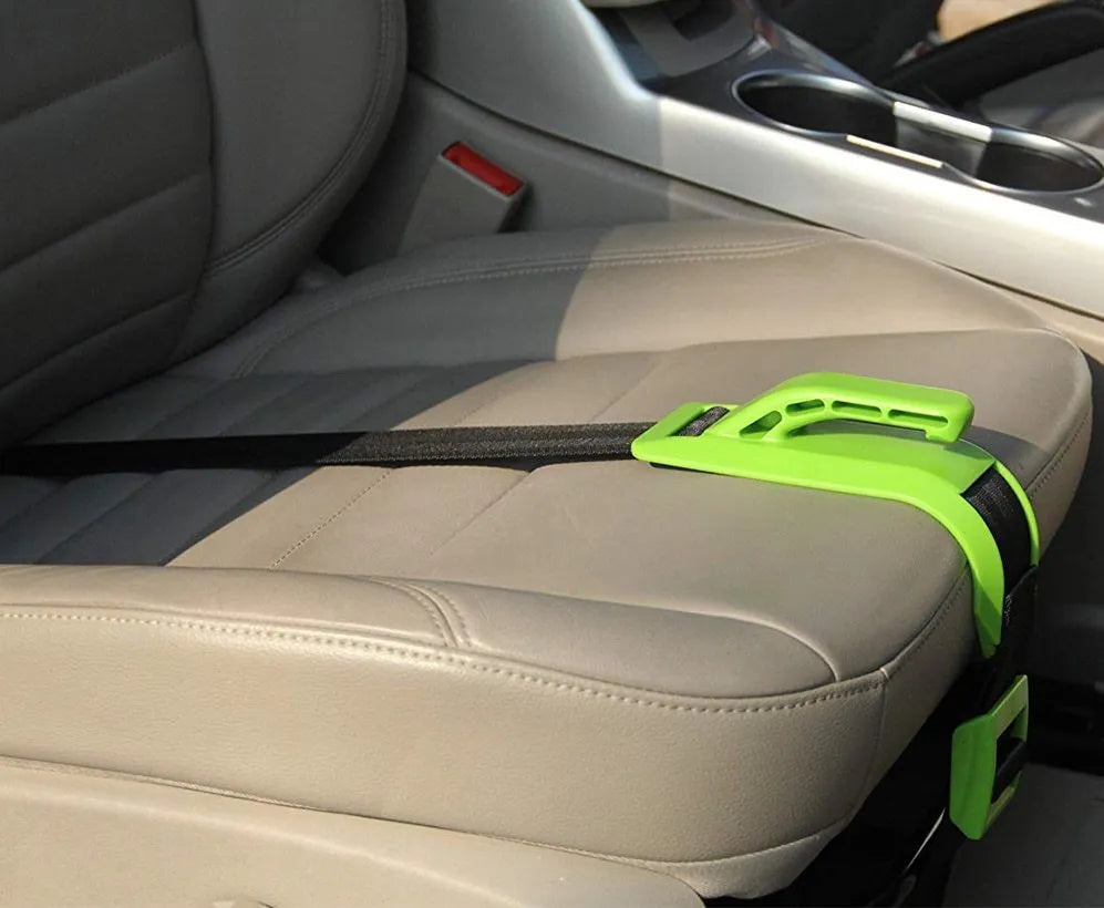 ZUWIT maternity car seat belt adjuster in white plastic attached to a seat belt, redirecting it away from the belly