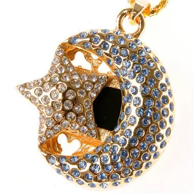 Silver metal Jewelry Xingyue USB flash drive with retractable connector on a plain background.