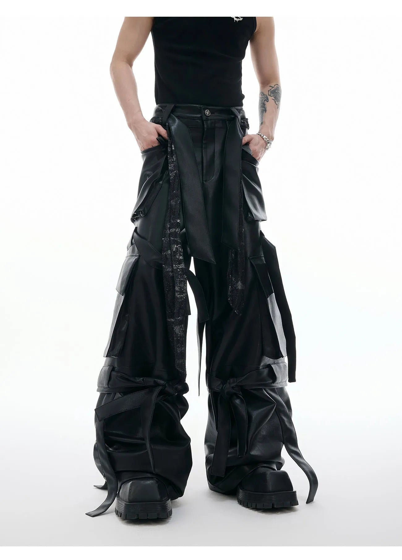 Black retro loose-fit trousers with multiple pockets and quilted leather-look fabric.