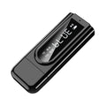 Matte black USB car FM Bluetooth receiver plugged into a 12V socket, showing its USB port and AUX input.