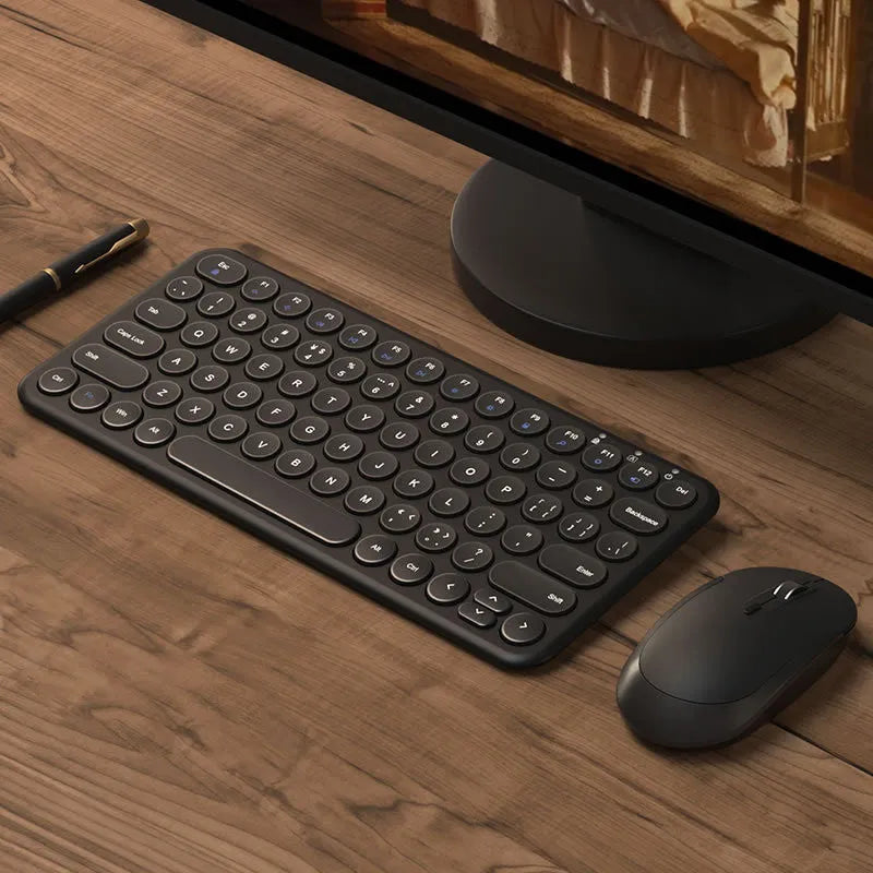 Mute brand ultra-thin wireless keyboard and mouse set with USB receiver on a wooden desk.
