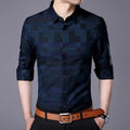 Men's cotton blend business casual shirt in blue, long sleeves, button-down front.