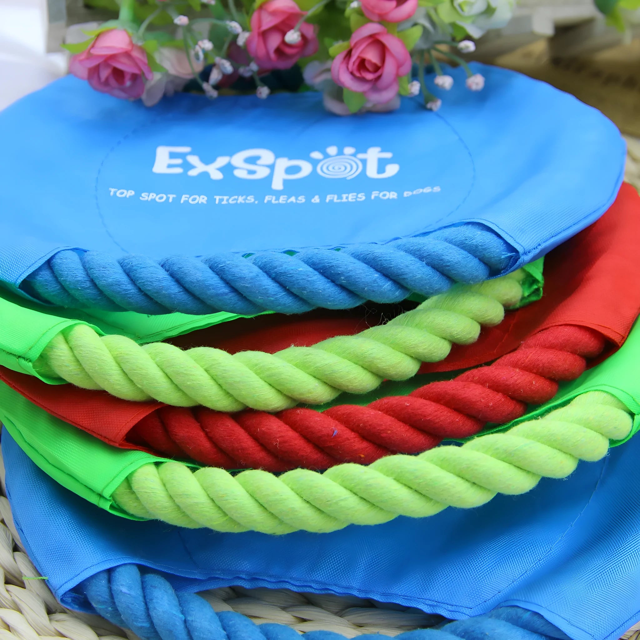 Canvas and rope dog flying disc toy with rain silk surface, 19cm diameter, on grass
