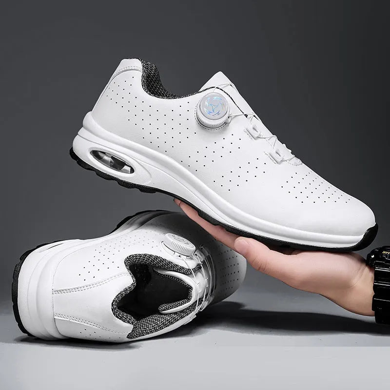 Black and white low-top men's tennis shoes with mesh upper and cross shoulder straps