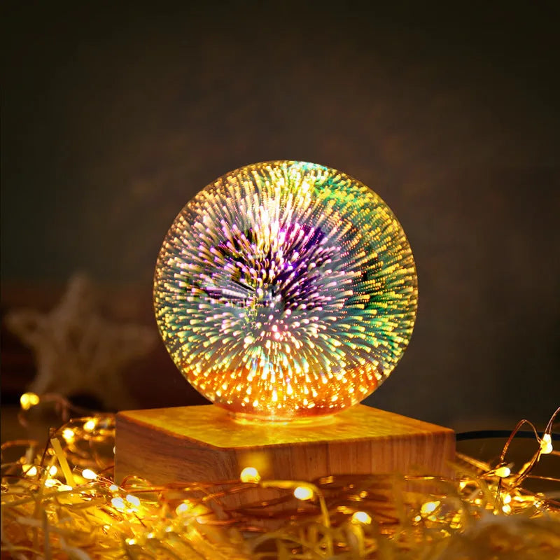 USB plug-in crystal ball night light displaying colourful firework pattern on a dark surface.