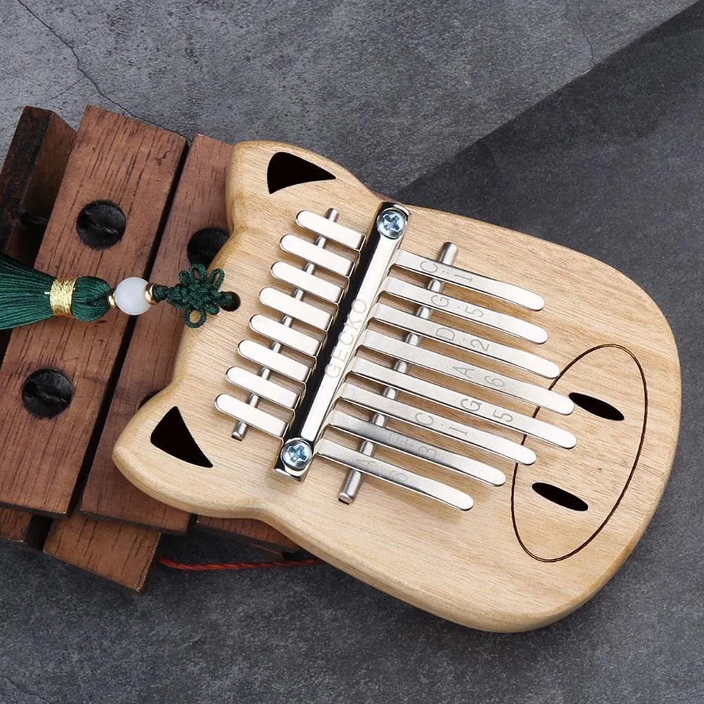 Camphorwood Mini K8 keyboard percussion instrument with five sounds in Piggy colour, 11.5 x 9 x 3 cm, with long and short lanyards