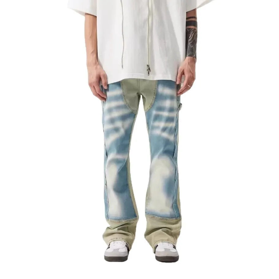 Yellow and blue retro patchwork splash-ink damaged design jeans with a zip fly.