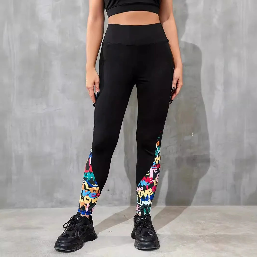 Black women's high-waisted yoga leggings with contrast patchwork design and side pocket.