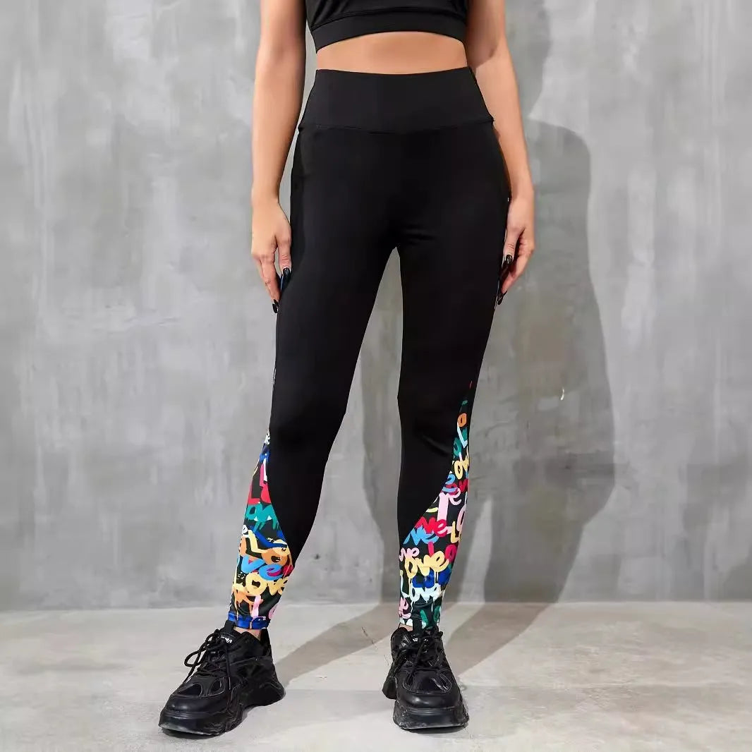 Black women's high-waisted yoga leggings with contrast patchwork design and side pocket.