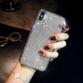 Silver rhinestone decorated silicone phone case for iPhone models showing full diamond pattern