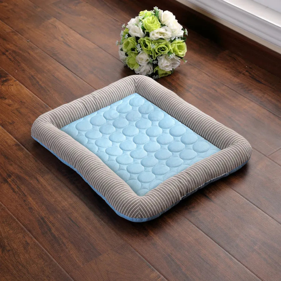 Blue pet cooling pad bed made of ice silk fabric with non-slip base for dogs and cats