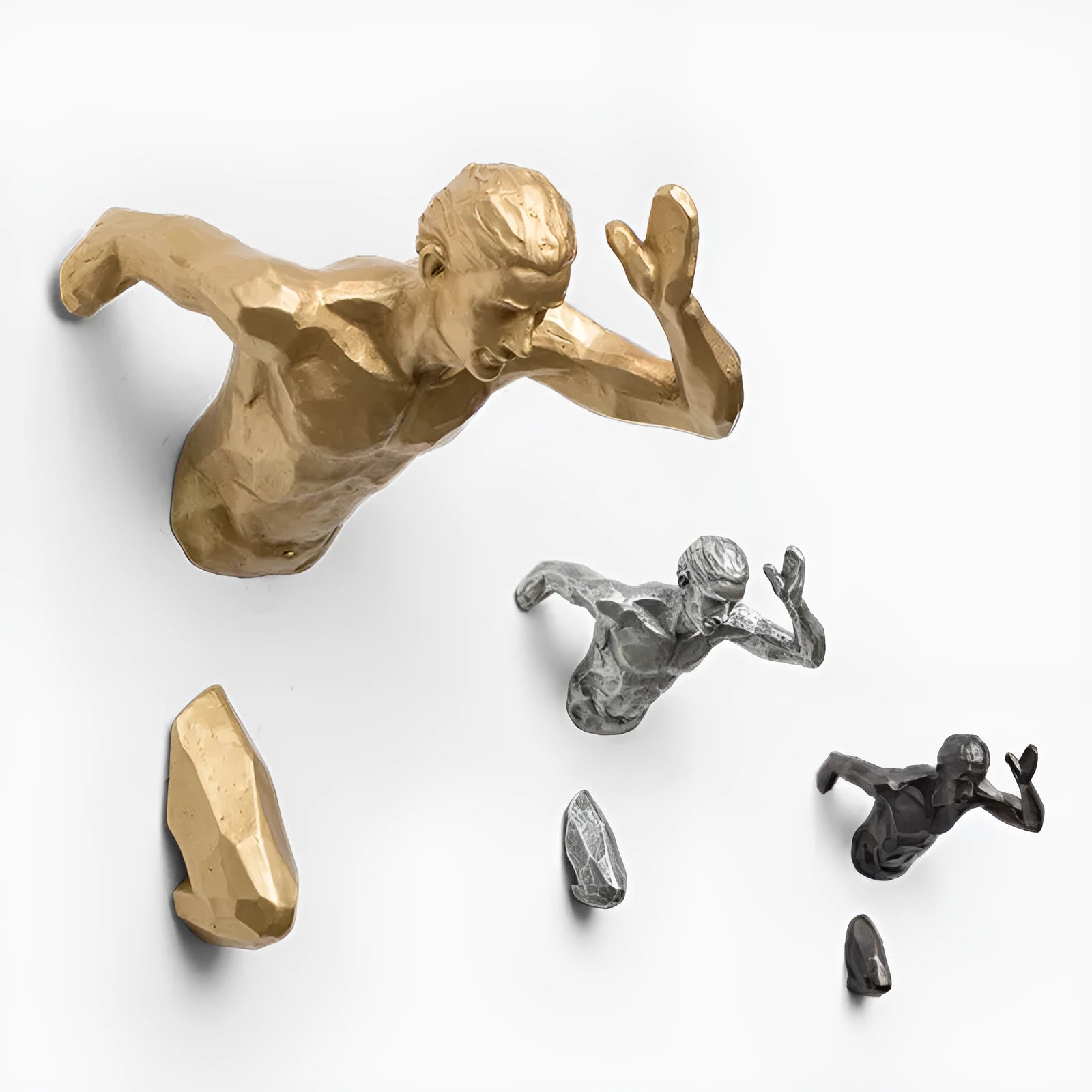 Resin character wall hanging decoration in metallic finish on a plain wall
