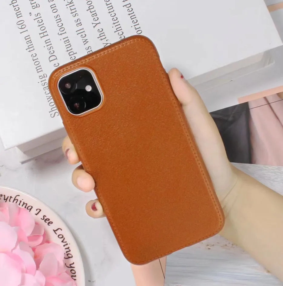 Leather iPhone case with TPU protection in Black, Brown, Navy Blue, and Wine Red colours