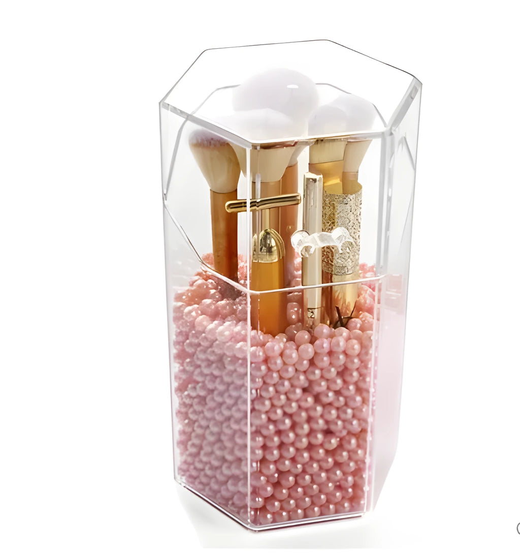 Transparent acrylic makeup brush storage bucket in solid colour plastic on bedroom countertop