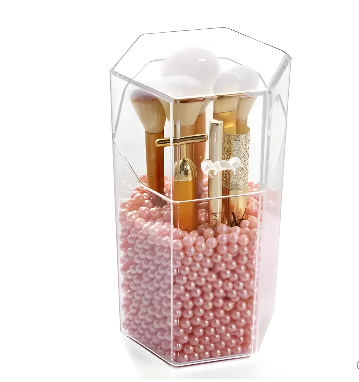 Transparent acrylic makeup brush storage bucket in solid colour plastic on bedroom countertop