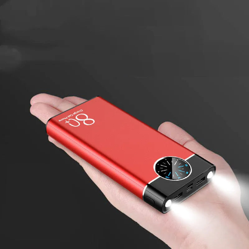 Black alloy fast charging power bank showing front with USB ports and LED flashlight.