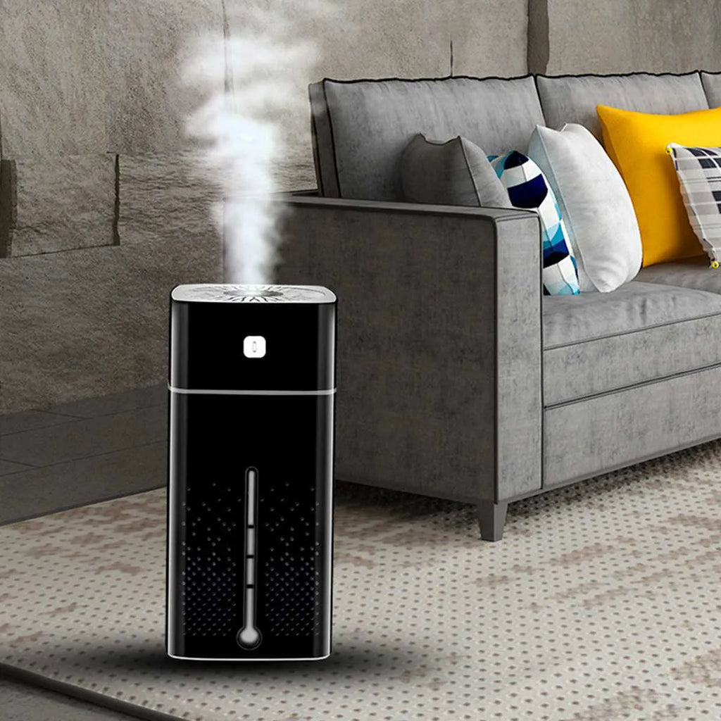 Black and white USB-powered desktop humidifier with 1000ml water tank on a desk.