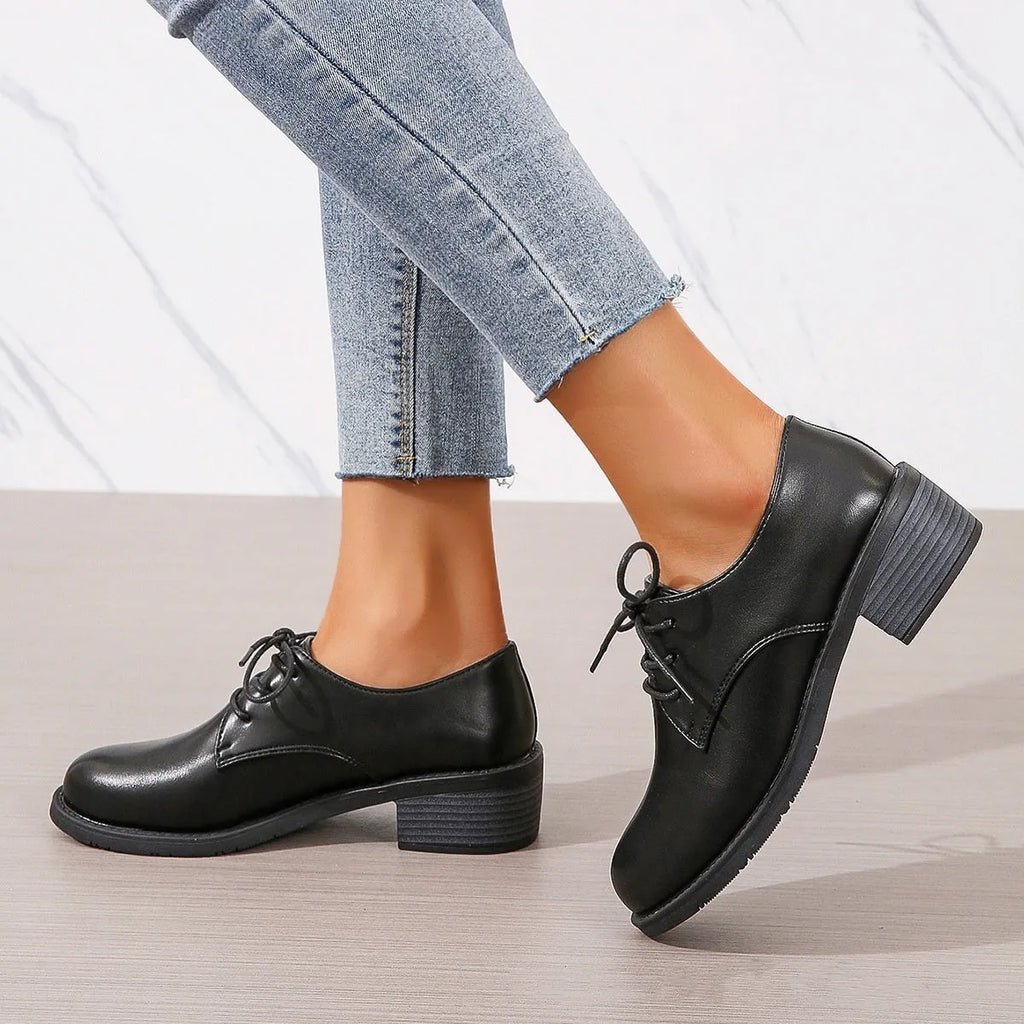 Black women's professional work shoes with chunky heel and low top design