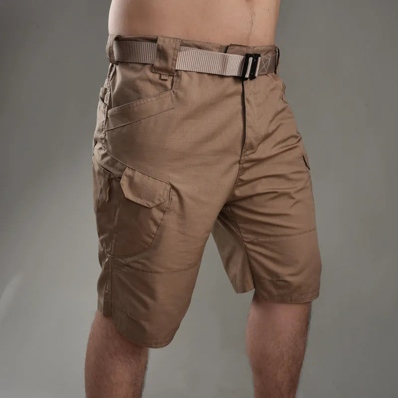 Men's khaki tactical shorts with button closure for hiking and outdoor work.
