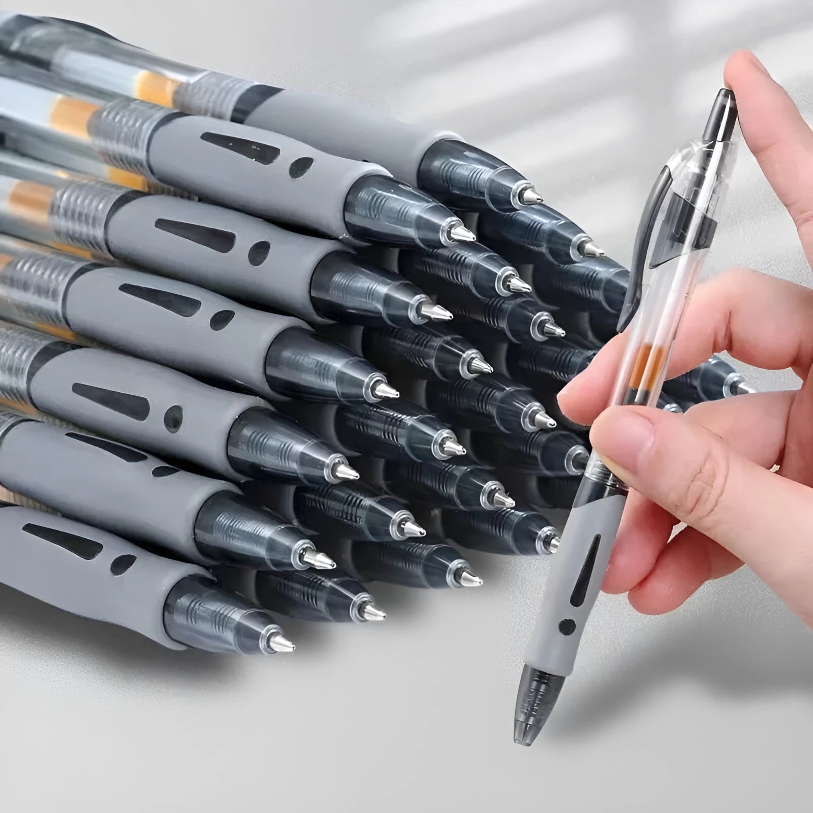A single plastic gel pen with a 0.5mm tip, shown in black, blue, and red ink colour options.
