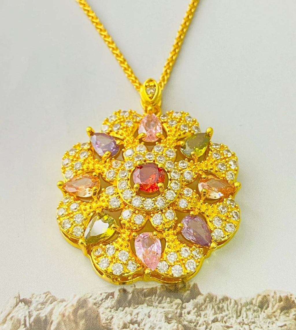 Close-up of a women's floral-shaped zircon pendant necklace in a gold colour finish with a matching chain.