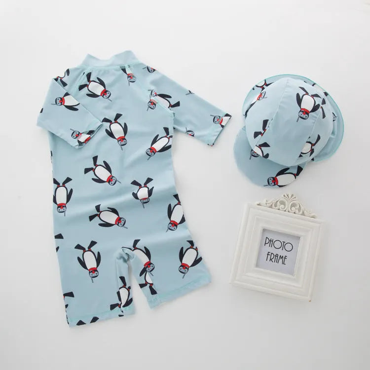 Boys' penguin print two-piece swim set with long sleeve rash guard top and matching swimming cap