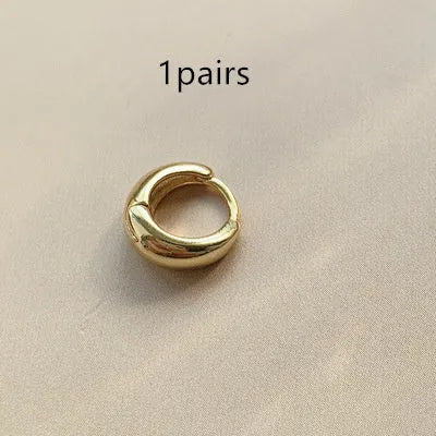 Women's geometric water drop earrings in gold or silver, shown in large, medium, and small sizes.