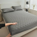 Diamond lattice quilted bamboo fibre mattress protector set with fitted sheet and pillowcases.