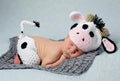 White hand-knitted baby cow suit set with hat and pants made from wool cotton blend