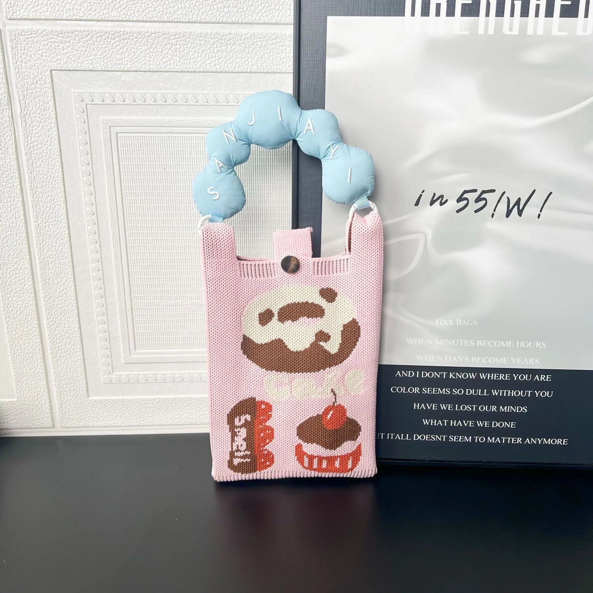 Cartoon knitted messenger bag with woven design and single shoulder strap