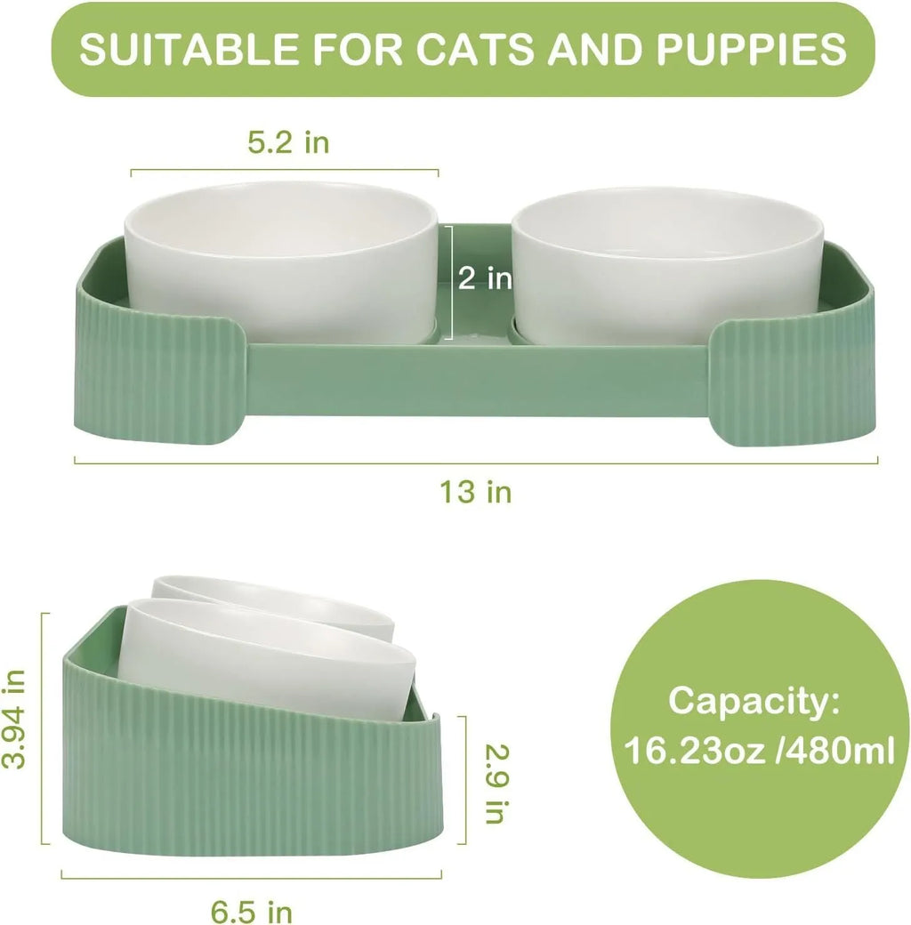 Green ceramic raised cat bowl set with two bowls on a tilted stand, showing non-slip base.