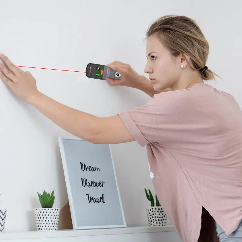 A red dust collection level meter bracket for an electric hammer drill, showing its compact size and laser window.